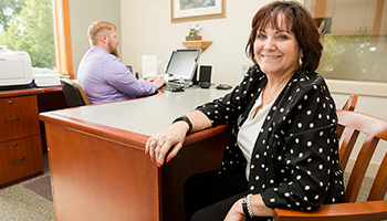 Smiling woman at desk