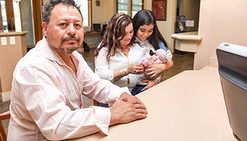 man sitting with family