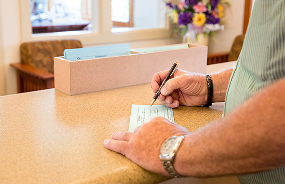 Man writing check